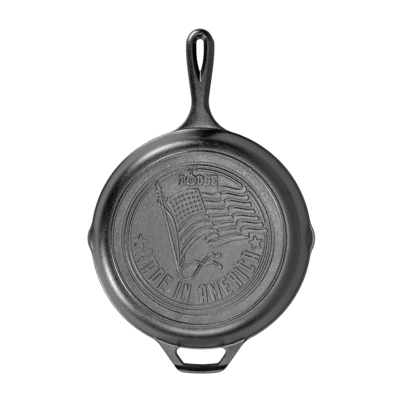Top view of handcrafted cast iron skillet with embossed American flag and "Made in America" lettering, featured in Kitchen & Food, Cookware, Cast Iron, USA Made, and Best Sellers collections.