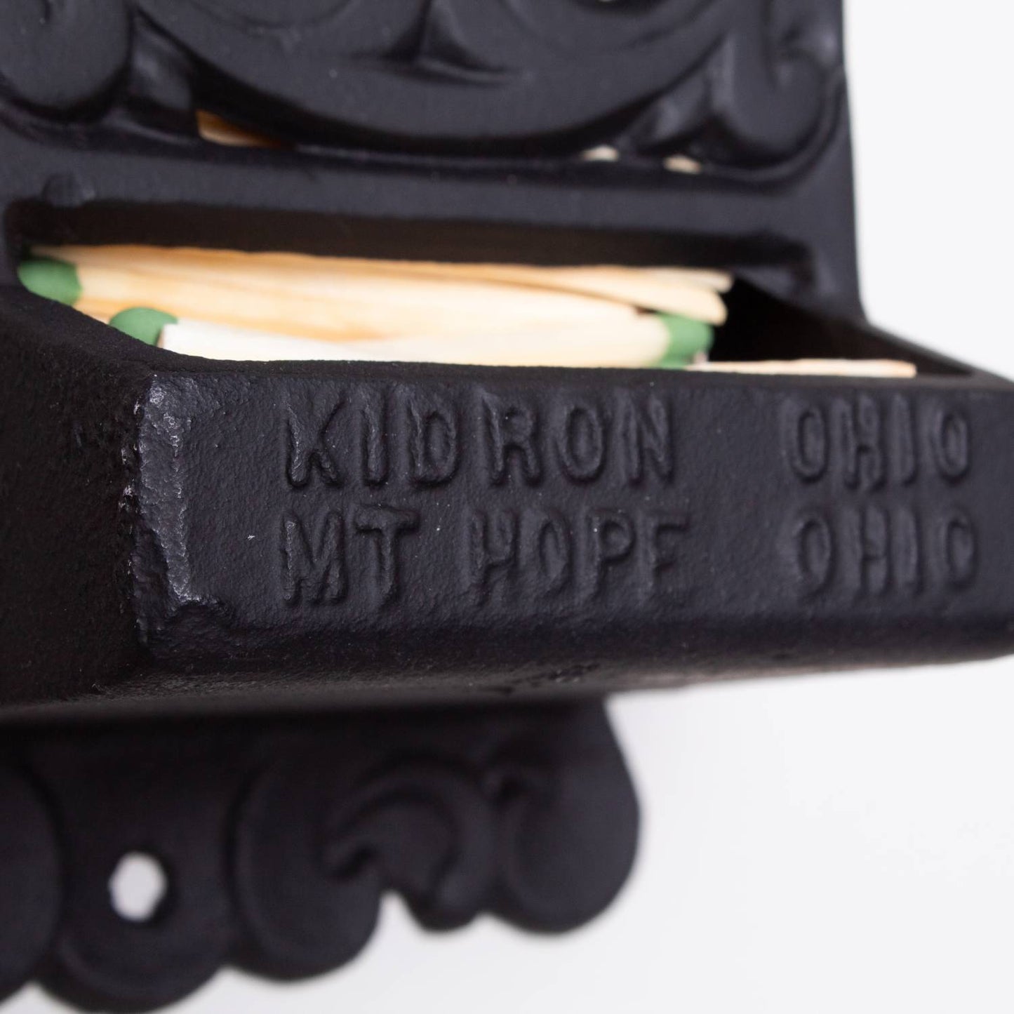 Handcrafted black metal wall-mounted match holder with embossed "Kidron Ohio Mt Hope Ohio," featuring vintage design, made in USA, ideal for Home & Decor, Household Helpers, and Best Sellers collections.