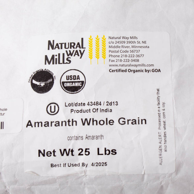 Close-up view of a white sack label for organic whole amaranth grain, highlighting certified organic packaging for pantry, farm, and emergency food supplies collections.
