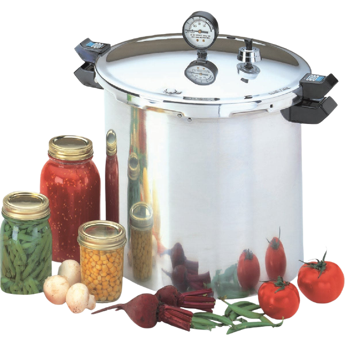 Large stainless steel pressure canner with secure locking lid, pressure gauge, and black handles, accompanied by jars of preserved vegetables and fresh produce, ideal for kitchen canning and food preservation collections.