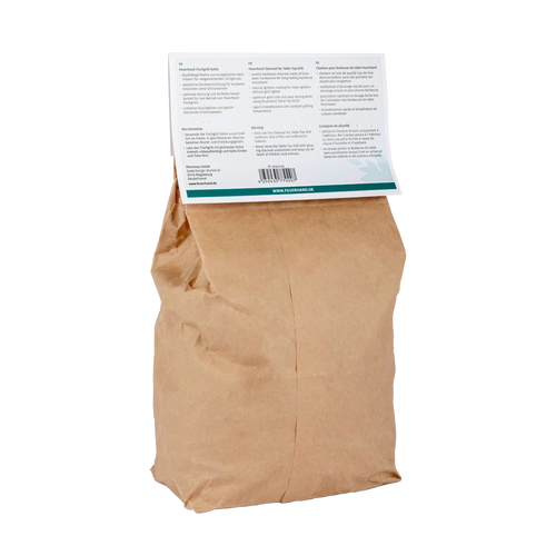 Brown paper bag of charcoal for tabletop grilling with a folded information label, ideal for grilling enthusiasts and featured in Stoves, Grilling, Best Sellers, and Promo Eligible collections.