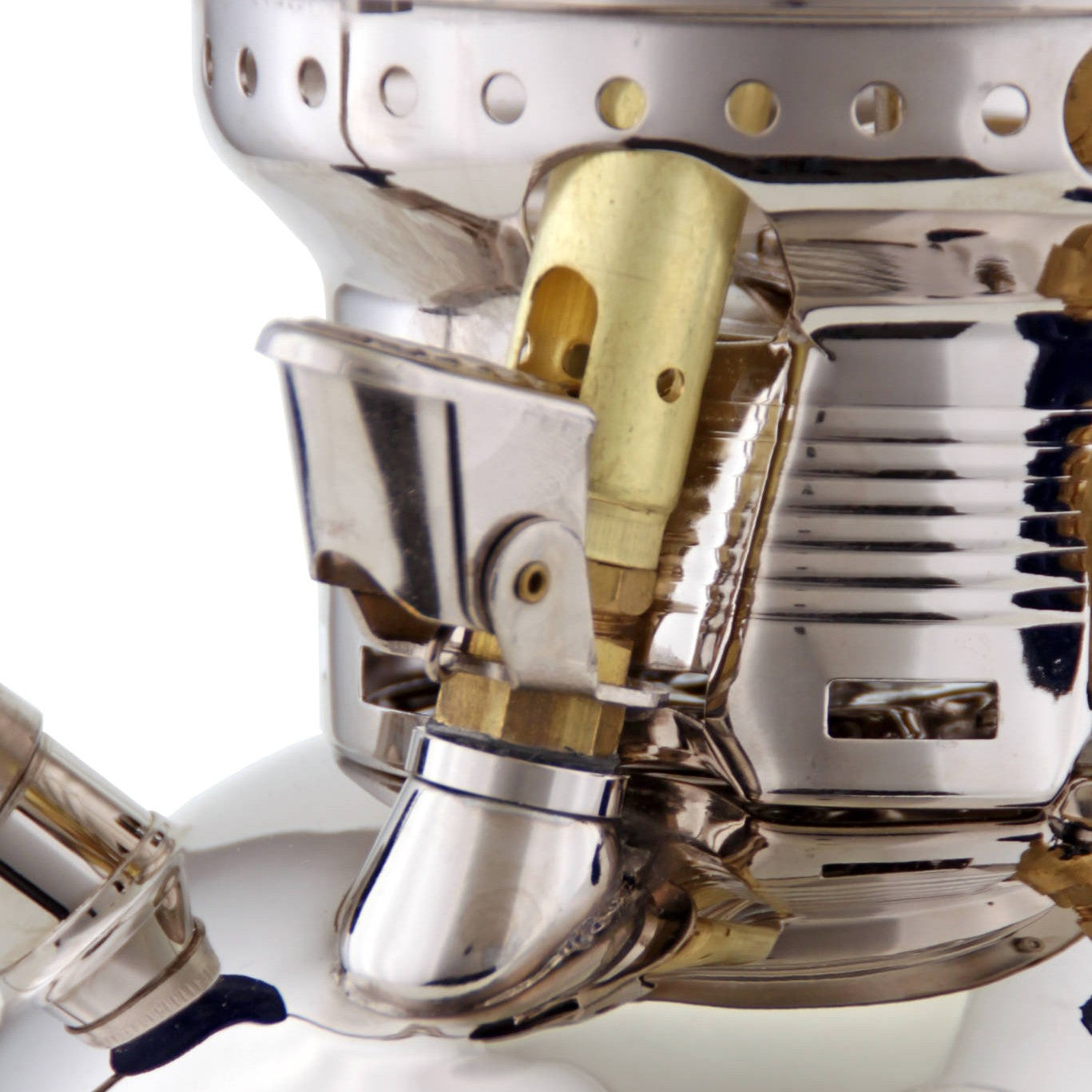 Close-up of the polished metal and brass components on a handcrafted Petromax HK500 kerosene pressure lamp, highlighting its durable design for camping, farm, and emergency use.