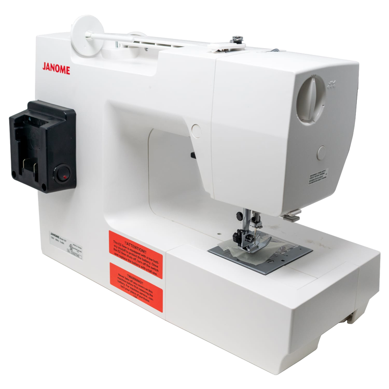 Compact white mechanical sewing machine powered by a battery pack, designed for efficient use in sewing and quilting, and ideal for homesteading and off-grid projects.