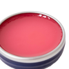 Open metal tin of handcrafted rose-colored salve with a smooth surface, made in USA, suitable for Health & Wellness, Health Remedies, and Best Sellers collections.