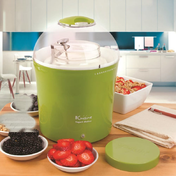 Bright green electric yogurt maker with clear plastic lid and glass jar inside, surrounded by fresh berries and granola in a bright kitchen setting, featured in Kitchen & Food and Specialty Equipment collections.