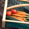 Handcrafted garden hod with wire mesh sides and wooden frame, made in USA, shown holding fresh carrots, tomatoes, and a cucumber, ideal for harvest washing and draining in Farm, Garden & Tool collections.