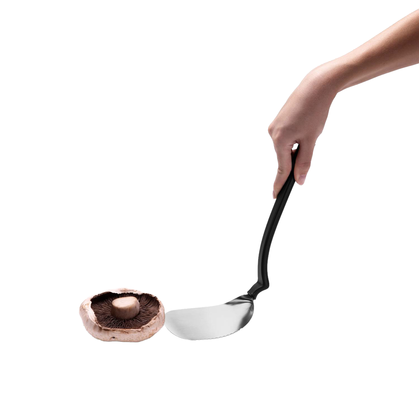 Flexible stainless steel grill spatula with black ergonomic handle held above a portobello mushroom, designed for flipping, cutting, and scraping in Kitchen & Food and Grilling collections.