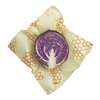 Large handmade beeswax wrap with honeycomb pattern enclosing a halved purple cabbage, ideal for eco-friendly food storage in Kitchen & Food, Storage and Serving, USA Made, and Best Sellers collections.