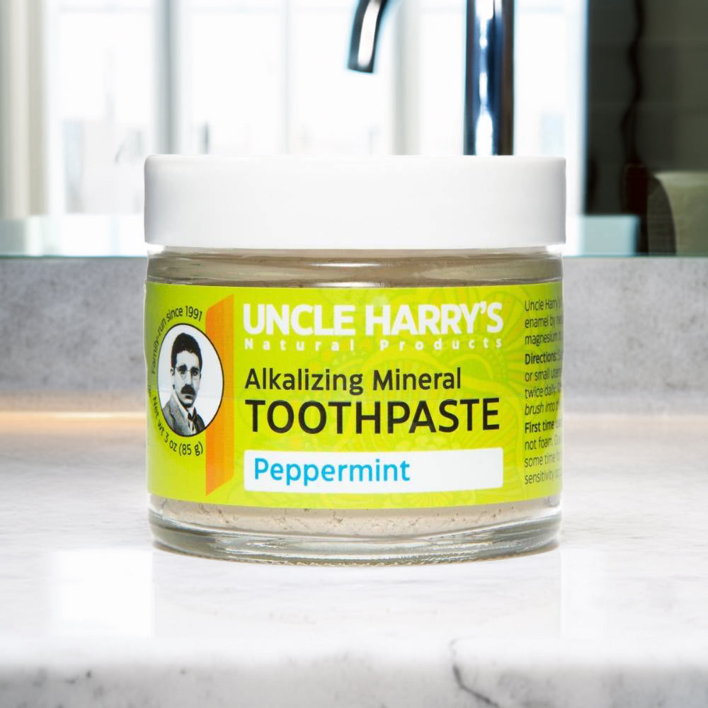 Handcrafted glass jar of peppermint-flavored alkalizing mineral toothpaste with white lid and bright yellow label, featured in Health & Wellness, Grooming and Personal Hygiene, USA Made, Best Sellers, and Promo Eligible collections.