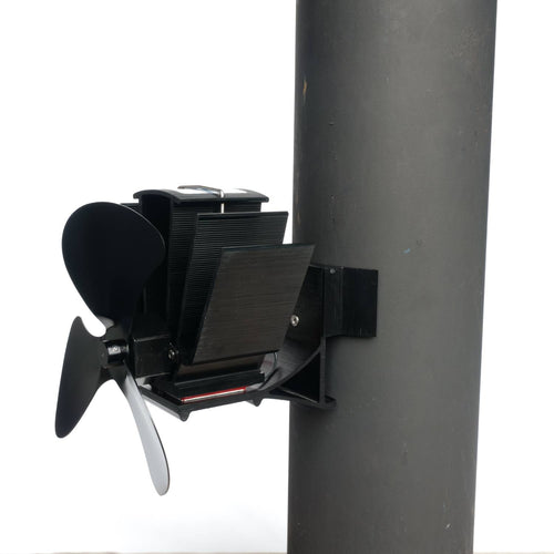 Black heat-powered magnetic stove fan with three blades, mounted on a flue pipe, designed for efficient warm air circulation; featured in Hearth Accessories and Best Sellers collections.