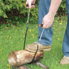 Handheld 28-inch pocket saw with dual black and orange handles and heat-treated multi-directional steel teeth cutting a log on grass, from Farm, Garden & Tool and Wood Cutting collections.
