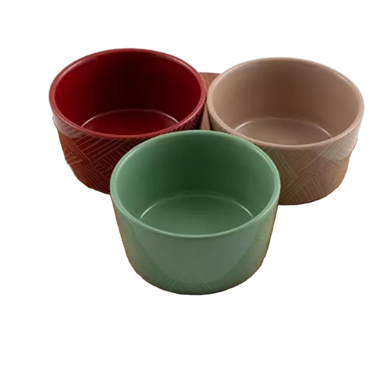 Set of three ceramic condiment bowls in red, beige, and green with subtle textured patterns, ideal for holiday entertaining and part of Kitchen & Food, Storage and Serving collections.