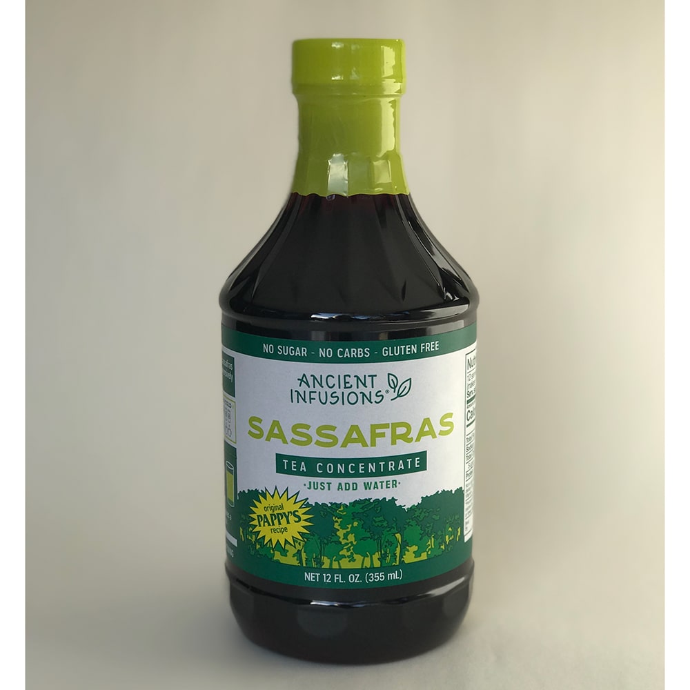 12 oz bottle of handcrafted Sassafras tea concentrate with green cap and label, made in USA, gluten-free, no sugar or carbs, featured in Kitchen & Food, Food, Beverages, and Best Sellers collections.