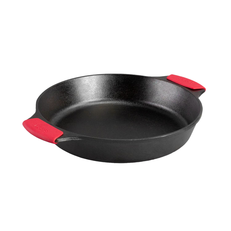 Handcrafted cast iron baker's skillet with dual handles featuring red silicone grips, designed for even heating and durability, part of Kitchen & Food, Cookware, Cast Iron, USA Made, Best Sellers, and Promo Eligible collections.