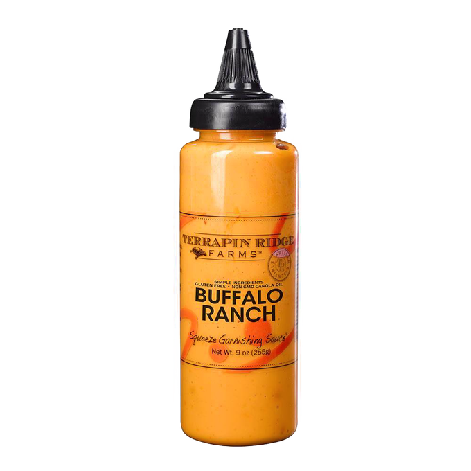 Plastic squeeze bottle filled with creamy orange Buffalo Ranch sauce featuring a black twist cap, ideal for Kitchen & Food, Pantry, Gluten Free, USA Made, and Best Sellers collections.