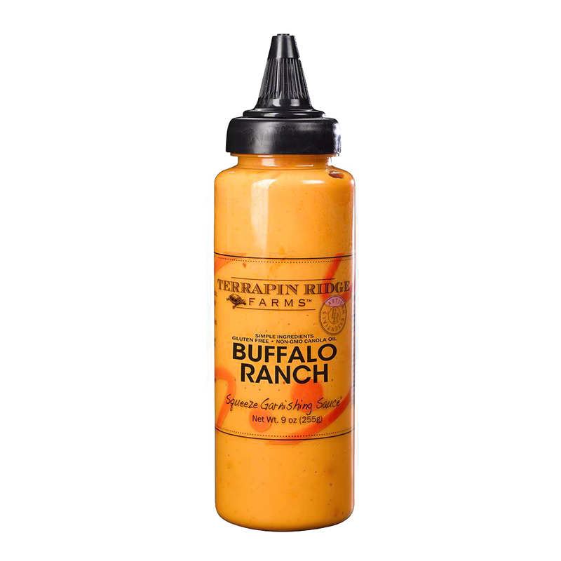 Plastic squeeze bottle filled with creamy orange Buffalo Ranch sauce featuring a black twist cap, ideal for Kitchen & Food, Pantry, Gluten Free, USA Made, and Best Sellers collections.