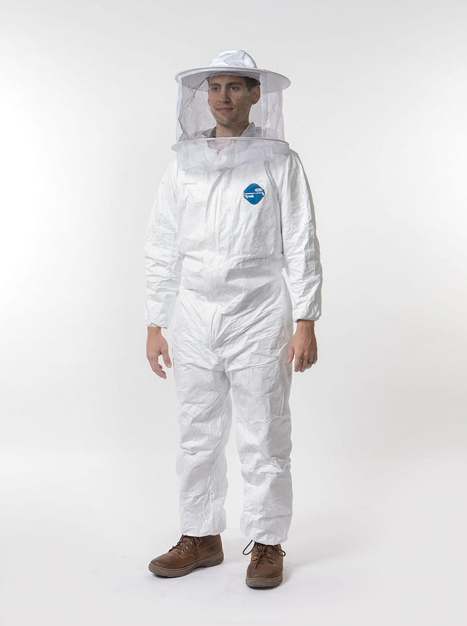 Person modeling white beekeeping coveralls with elastic cuffs and ankles, featuring a full-front zipper and a protective veil hat accessory, ideal for Farm, Garden & Tool and Beekeeping Supplies collections.