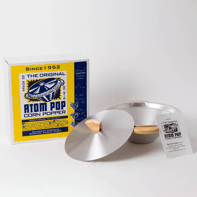 Aluminum stovetop popcorn popper with a conical bowl and wooden handles, designed for easy use without stirring, featured in Kitchen & Food, Cookware, and Pots and Pans collections.