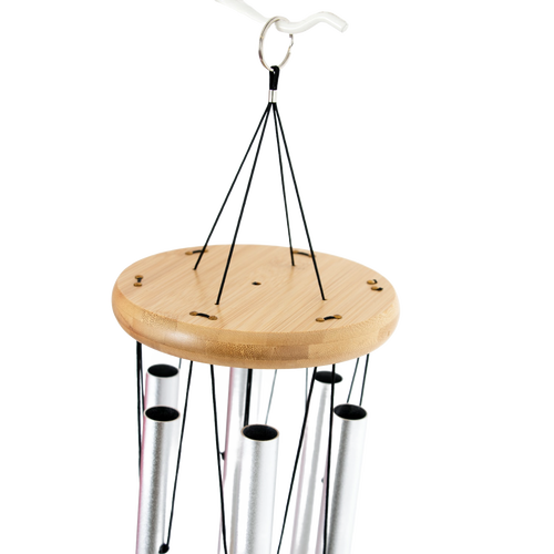 Handcrafted windchime with silver metal tubes and smooth circular wooden windcatcher, designed to bring calming melodies to farm, garden, and outdoor living spaces.