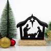 Handcrafted cast iron nativity scene on a wooden base featuring the Holy Family and North Star silhouette, perfect for Home & Decor, Holiday Decor, Best Sellers, and Promo Eligible collections.