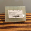 Handcrafted translucent olive oil soap base bar weighing one pound, naturally enriched with Vitamin E and antioxidants, perfect for health and wellness soapmaking supplies.