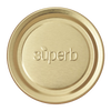 Round metal canning jar lid in a natural brass tone embossed with the word superb, designed for food preservation and kitchen use, part of a USA made collection.