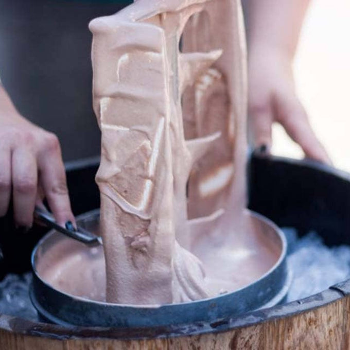Close-up of Amish made wooden ice cream freezer in use, showing creamy frozen chocolate ice cream being lifted with a metal paddle, part of Kitchen & Food and Specialty Equipment collections.