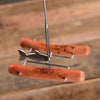 Unique handcrafted steel roasting tool designed to hold and rotate hot dogs for even cooking over a campfire, perfect for Camping, Farm, Garden & Tool, and Best Sellers collections.