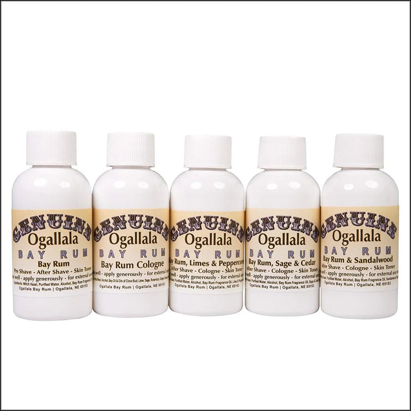 Row of five handcrafted Ogallala Bay Rum cologne and aftershave bottles featuring original, lime and pepper, sage and cedar, and sandalwood scents, made in USA for grooming and personal hygiene collections.