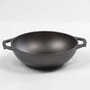 Handcrafted cast iron mini wok with a flat bottom and loop handles, designed for efficient cooking on all surfaces, featured in USA made kitchen cookware and best sellers collections.