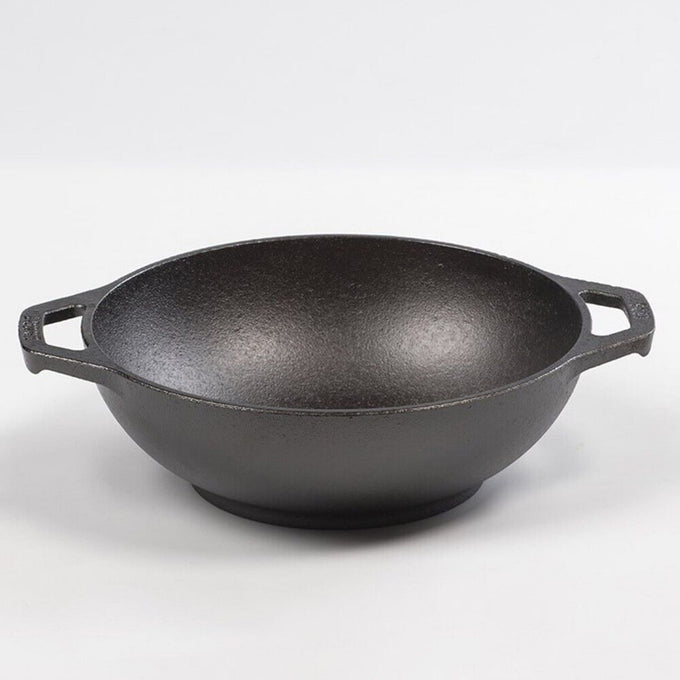 Handcrafted cast iron mini wok with a flat bottom and loop handles, designed for efficient cooking on all surfaces, featured in USA made kitchen cookware and best sellers collections.