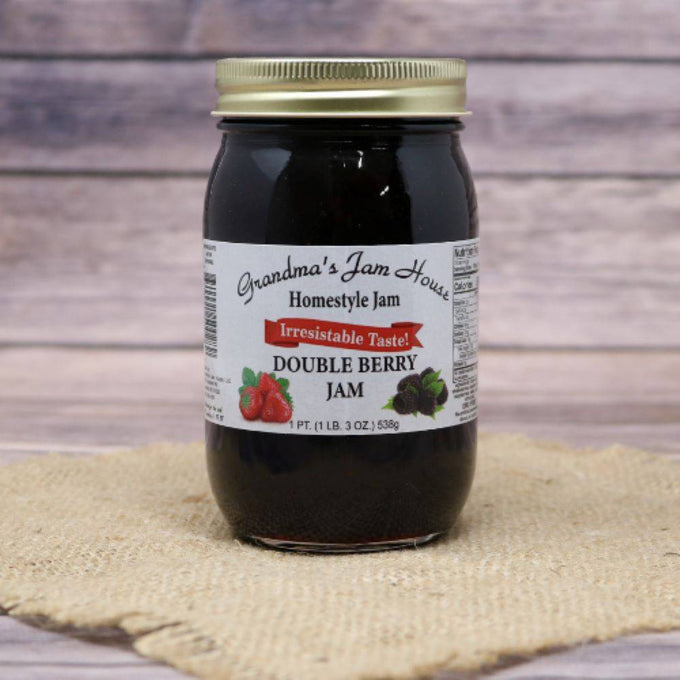 Glass jar of handcrafted double berry jam with gold lid and white label featuring raspberry and blackberry illustrations, included in Kitchen & Food, Pantry, Peanut Butter & Jellies, USA Made, Best Sellers, and Promo Eligible collections.