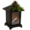 Black metal lantern featuring a cozy LED faux fireplace with silver logs, topped with festive pine sprigs, red berries, and a pinecone, perfect for Home & Decor, Holiday Decor, Best Sellers, and Promo Eligible collections.