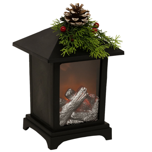 Black metal lantern featuring a cozy LED faux fireplace with silver logs, topped with festive pine sprigs, red berries, and a pinecone, perfect for Home & Decor, Holiday Decor, Best Sellers, and Promo Eligible collections.