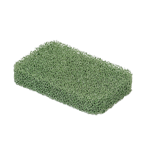Green silicone cooktop scrubber with a porous texture, designed for durable, odor-resistant cleaning in household and kitchen settings, made in USA.