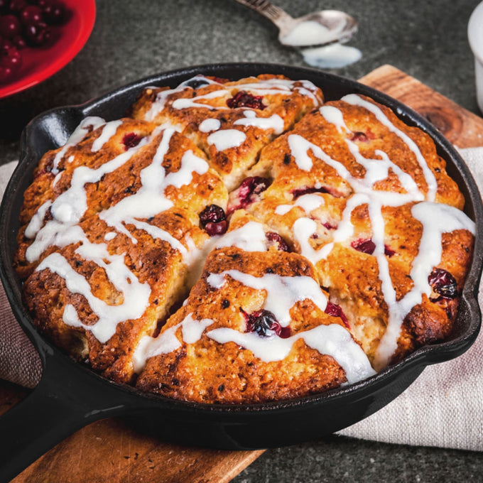 Handcrafted dessert baked in a black 6-inch cast iron skillet topped with a drizzle of icing, featuring berries, ideal for Kitchen & Food, Dry Goods and Mixes, Best Sellers, Promo Eligible collections.