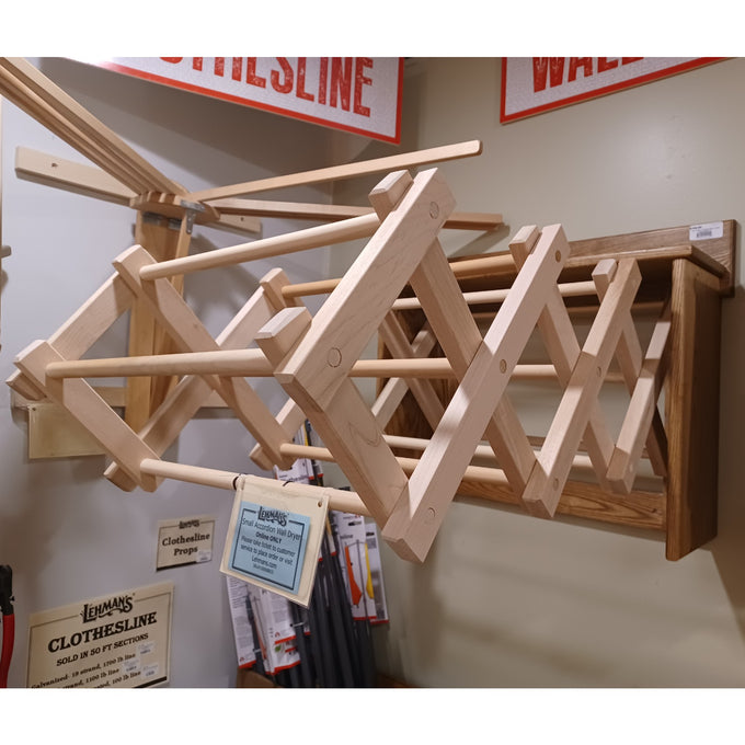 Handcrafted Amish made wooden expandable wall clothes dryer mounted on the wall, designed for laundry supplies, drying accessories, and home decor collections.