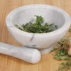Solid marble mortar and pestle with fresh herbs, handcrafted for durable use without flavor transfer, ideal for Kitchen & Food, Food Prep, Choppers and Cutters, Best Sellers, Promo Eligible collections.