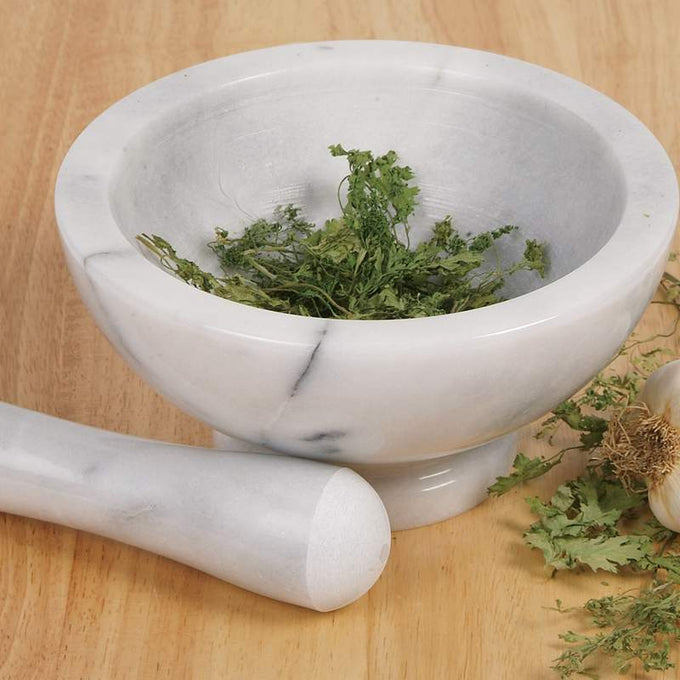 Solid marble mortar and pestle with fresh herbs, handcrafted for durable use without flavor transfer, ideal for Kitchen & Food, Food Prep, Choppers and Cutters, Best Sellers, Promo Eligible collections.