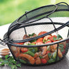 Black wire mesh grill basket with lid holding colorful grilled vegetables and shrimp, designed for smoky flavor infusion, ideal for outdoor cooking in kitchen and grilling collections.