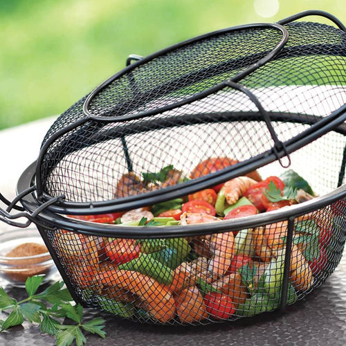 Black wire mesh grill basket with lid holding colorful grilled vegetables and shrimp, designed for smoky flavor infusion, ideal for outdoor cooking in kitchen and grilling collections.