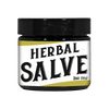 Small dark glass jar with black lid containing handmade herbal salve for soothing scrapes, bug bites, and dry skin, ideal for Health & Wellness and USA Made collections.