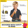 Young child wearing clear safety goggles and using a screwdriver on a wooden toy car, shown with additional hand tools featuring ergonomic yellow and black handles for indoor play and learning.