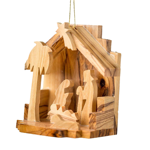 Handcrafted olive wood nativity scene ornament featuring silhouettes of the Holy Family inside a small rustic grotto, perfect for Home & Decor and Holiday Decor collections.
