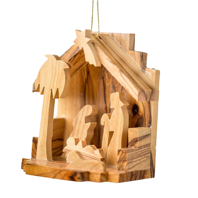 Handcrafted olive wood nativity scene ornament featuring silhouettes of the Holy Family inside a small rustic grotto, perfect for Home & Decor and Holiday Decor collections.