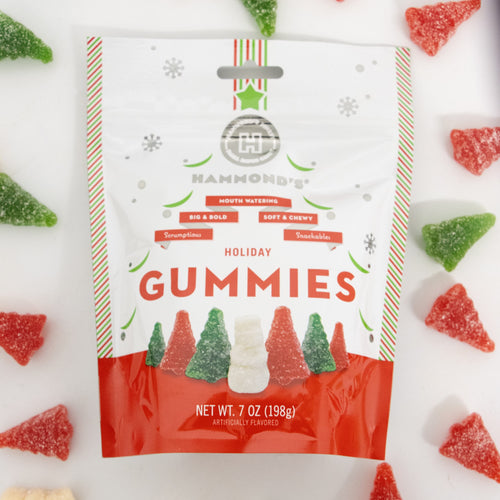 White and red resealable bag of handcrafted, USA-made holiday gummies shaped like Christmas trees and snowmen, sugar-coated and featured in Kitchen & Food, Snacks and Sweets, Candy, USA Made, Best Sellers, and Promo Eligible collections.