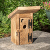 Handcrafted Amish-made birdhouse made from reclaimed wood with a hinged door, rustic metal hinges, and a moon cutout, featured in Farm, Garden & Tool and USA Made collections.