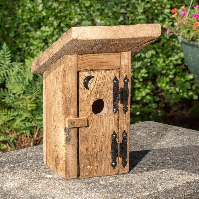 Handcrafted Amish-made birdhouse made from reclaimed wood with a hinged door, rustic metal hinges, and a moon cutout, featured in Farm, Garden & Tool and USA Made collections.