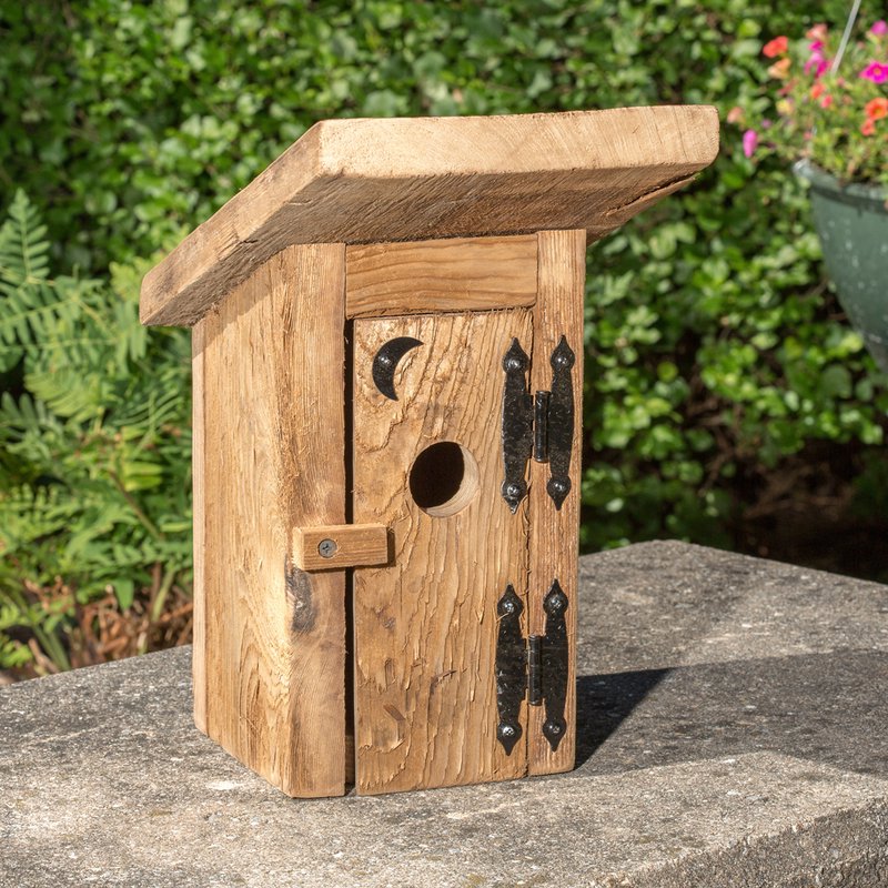 Handcrafted Amish-made birdhouse made from reclaimed wood with a hinged door, rustic metal hinges, and a moon cutout, featured in Farm, Garden & Tool and USA Made collections.