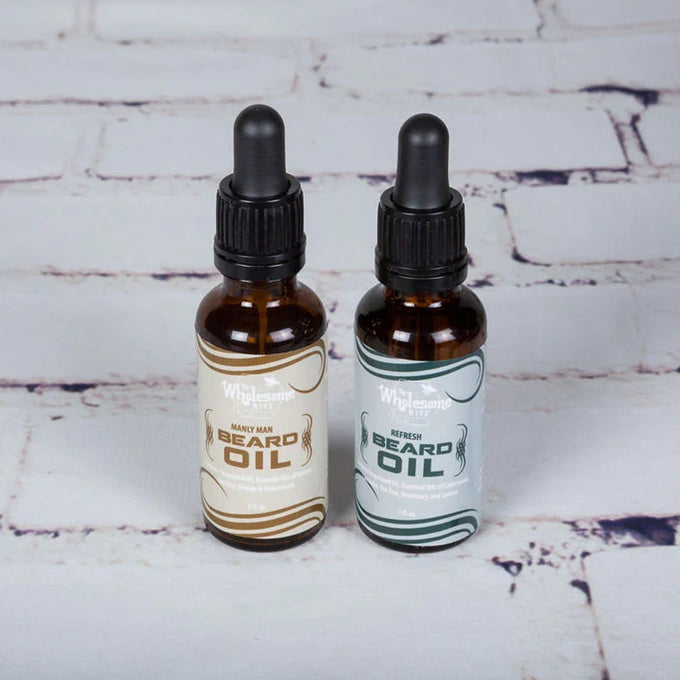 Two handcrafted amber glass bottles of locally-crafted beard oil with black dropper caps, featuring natural grapeseed and essential oils, perfect for Health & Wellness, Grooming and Personal Hygiene, USA Made, Best Sellers, and Promo Eligible collections.